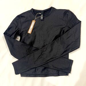 SKIMS black shine spandex jersey. Long sleeve cropped tee